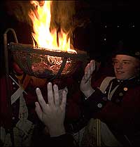 Warming hands by a cresset