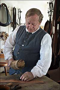 Hammering a pricking iron with a mallet