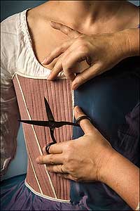 Mantua maker Janea Whitacre takes scissors to the seam of a set of stays.