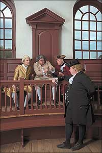 John Needre, Williams, and Joseph Musika, right, with Tom Hay in front, examine the evidence in court.