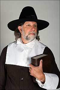  Mike Durling wears a pilgrim’s somber wardrobe.