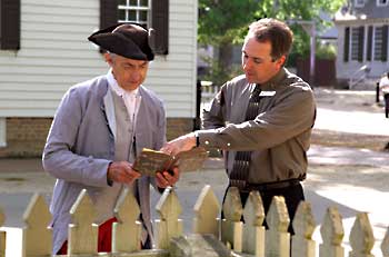 Interpreter Don Kline, left, confers with Mark Howell, acting director of program development, about the syntax found in an eighteenth-century book