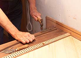 Redstone’s diminutive Claremont, Virginia, workshop gives him all the space he needs to plane, drill, and pound fine woods and brass bits into authentic re-creations of eighteenth-century harpsichords. - Dave Doody