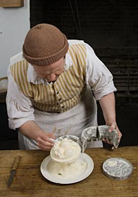 Brantley removes the ice cream from the mold after a quick dunk in warm water to loosen the sides.