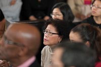 Carmen Paraggua Allen listens to President Colin Campbell speak at Colonial Williamsburg’s Capitol’s winter naturalization ceremony.