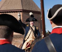 Mark Schneider as the Marquis de Lafayette exhorts the troops in front of the Historic Area’s Magazine.