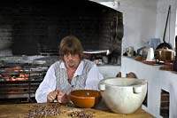 Frank Clark removes the shells and debris from the cocoa seeds.