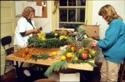 Flower arrangers work with naturally preserved materials.